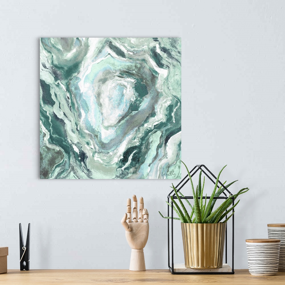 A bohemian room featuring Square abstract painting of quartz showing the agate in shades of green, blue, and white.
