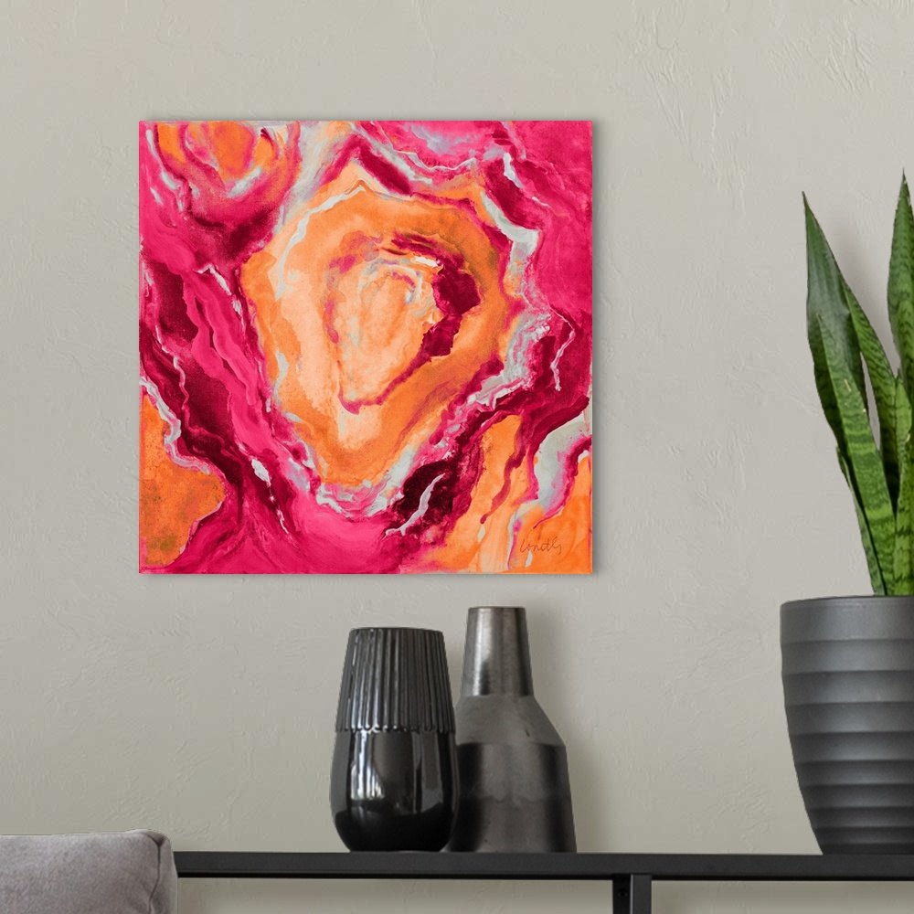 A modern room featuring Square abstract painting of quartz showing the agate in dark shades of orange, pink, and gray.