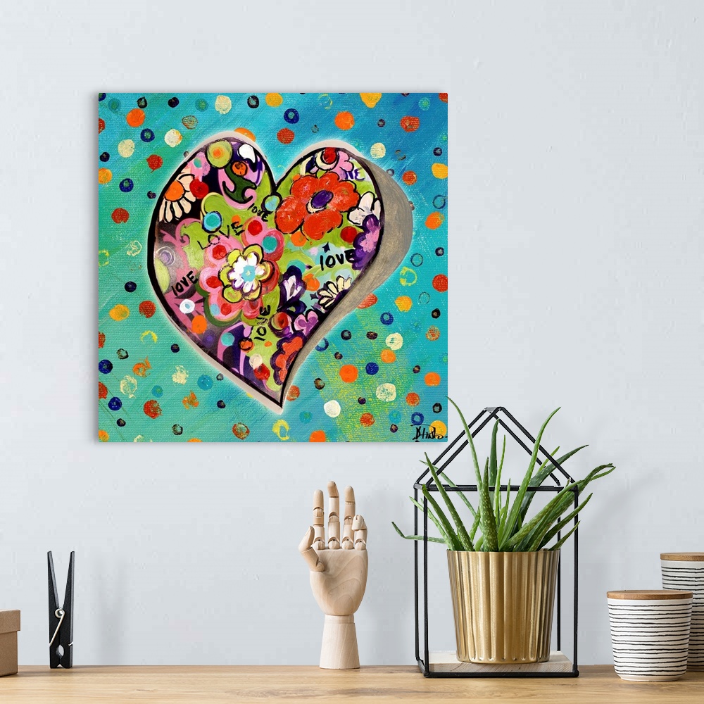 A bohemian room featuring Heart shape filled with bright flowers on a colorful dotted background.