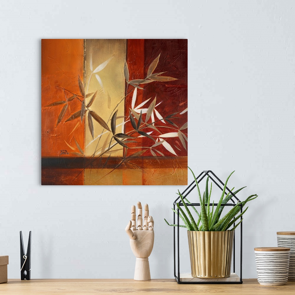 A bohemian room featuring Rust-colored painting of leaves with vertical striped background.