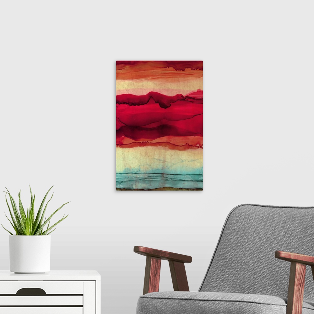 A modern room featuring Abstract painting with orange, pink, red, and blue hues layered together to resemble mountains.