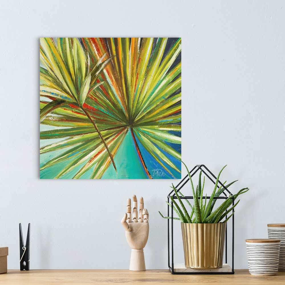 A bohemian room featuring Painting of a vibrant green palm frond against a blue green background.