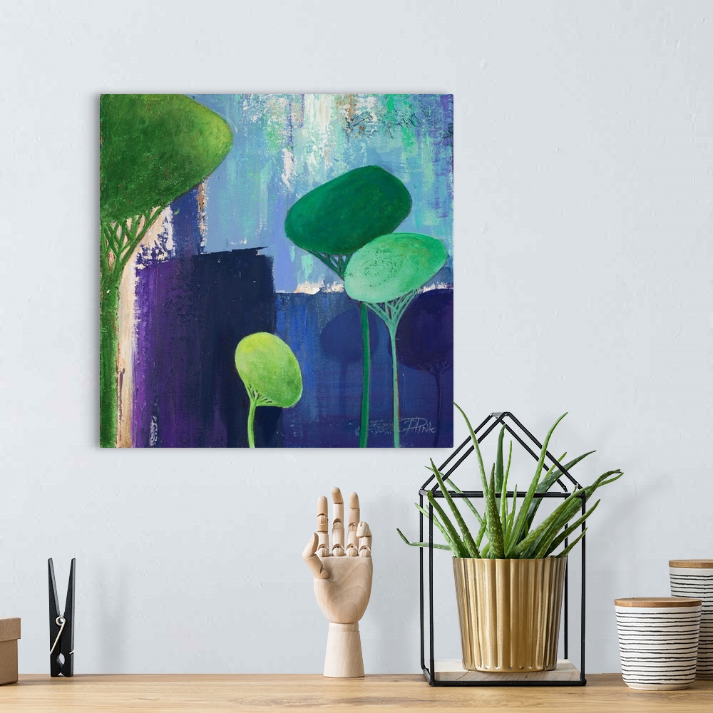 A bohemian room featuring A contemporary painting of abstract trees on a blue layered background.