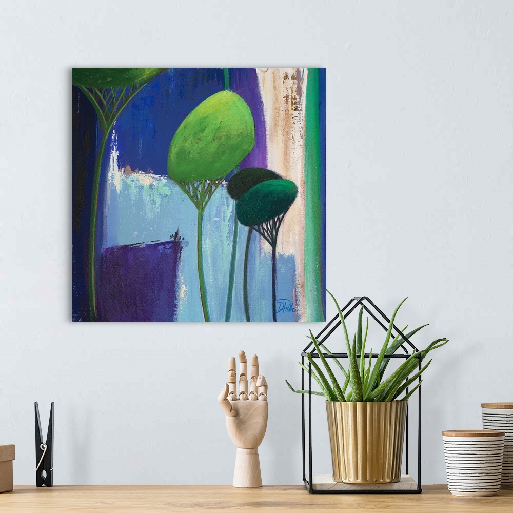 A bohemian room featuring A contemporary painting of abstract trees on a blue layered background.