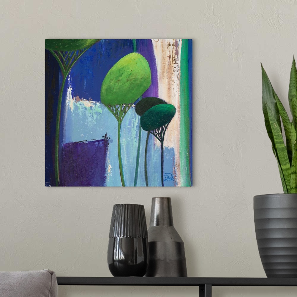 A modern room featuring A contemporary painting of abstract trees on a blue layered background.
