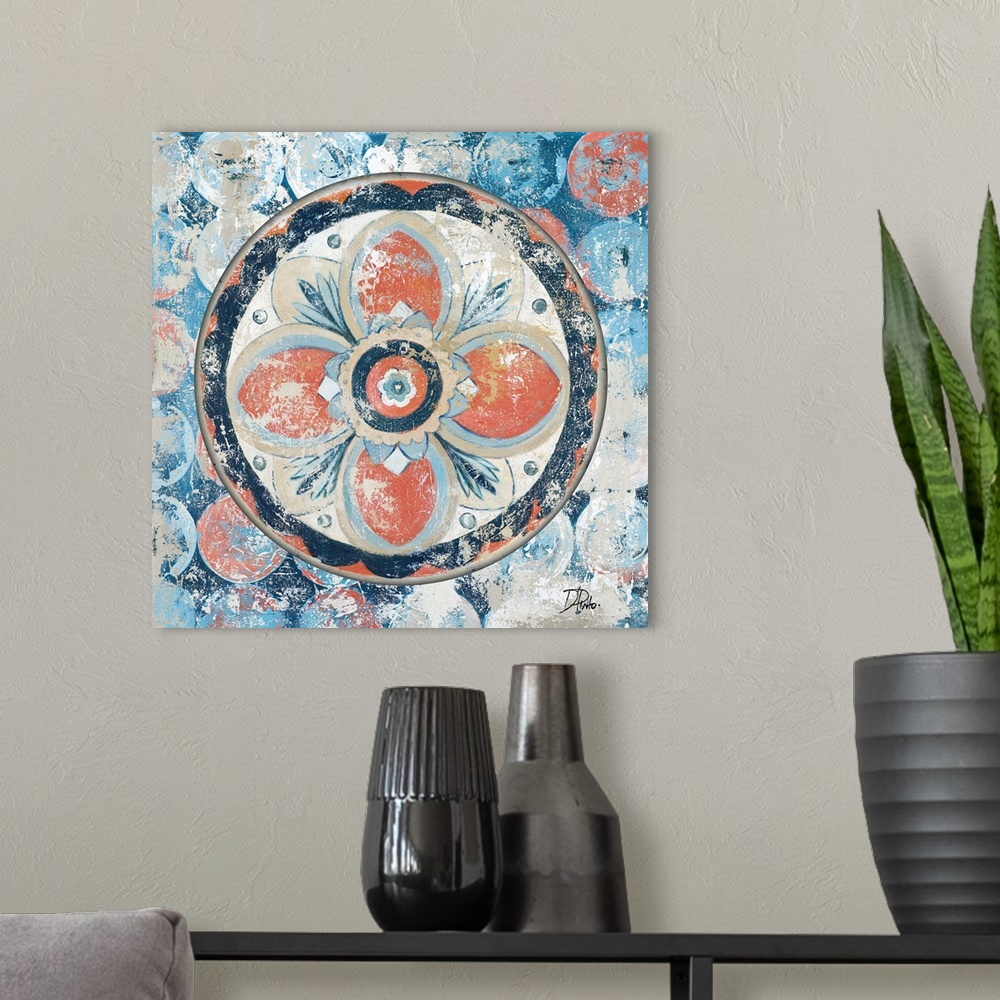 A modern room featuring A decorative antique style painting of a medallion with a floral design on top of a circular patt...