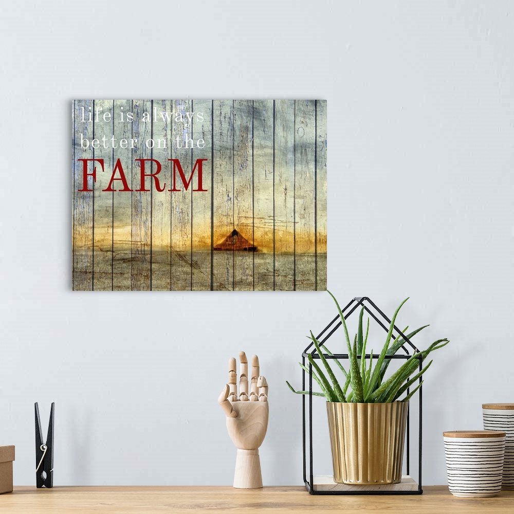 A bohemian room featuring Painting of a farm scene with a red barn and golden horizon with the phrase "Life is always bette...