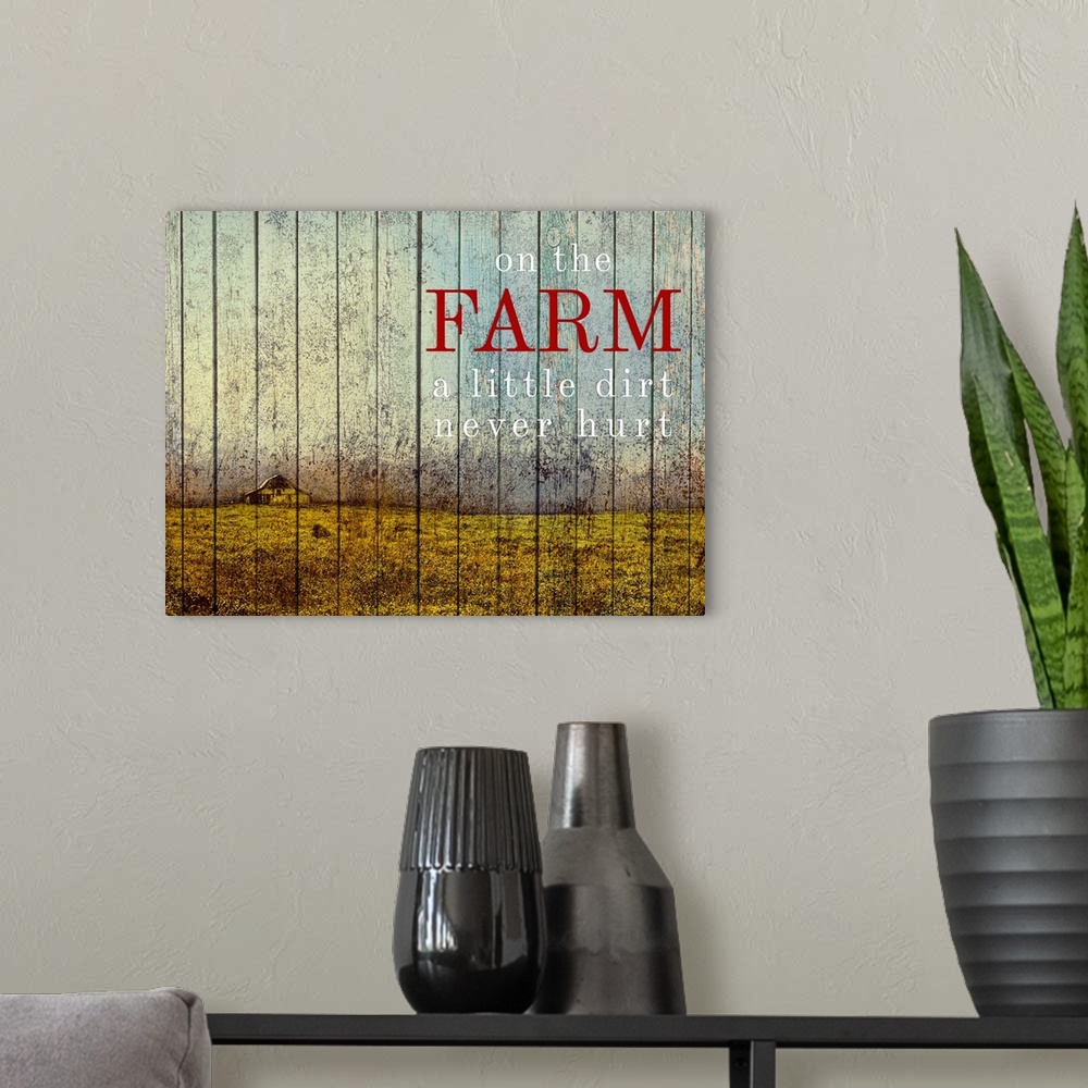 A modern room featuring Wood paneled painting farmland with a yellow barn and the saying "On the Farm a little dirt never...