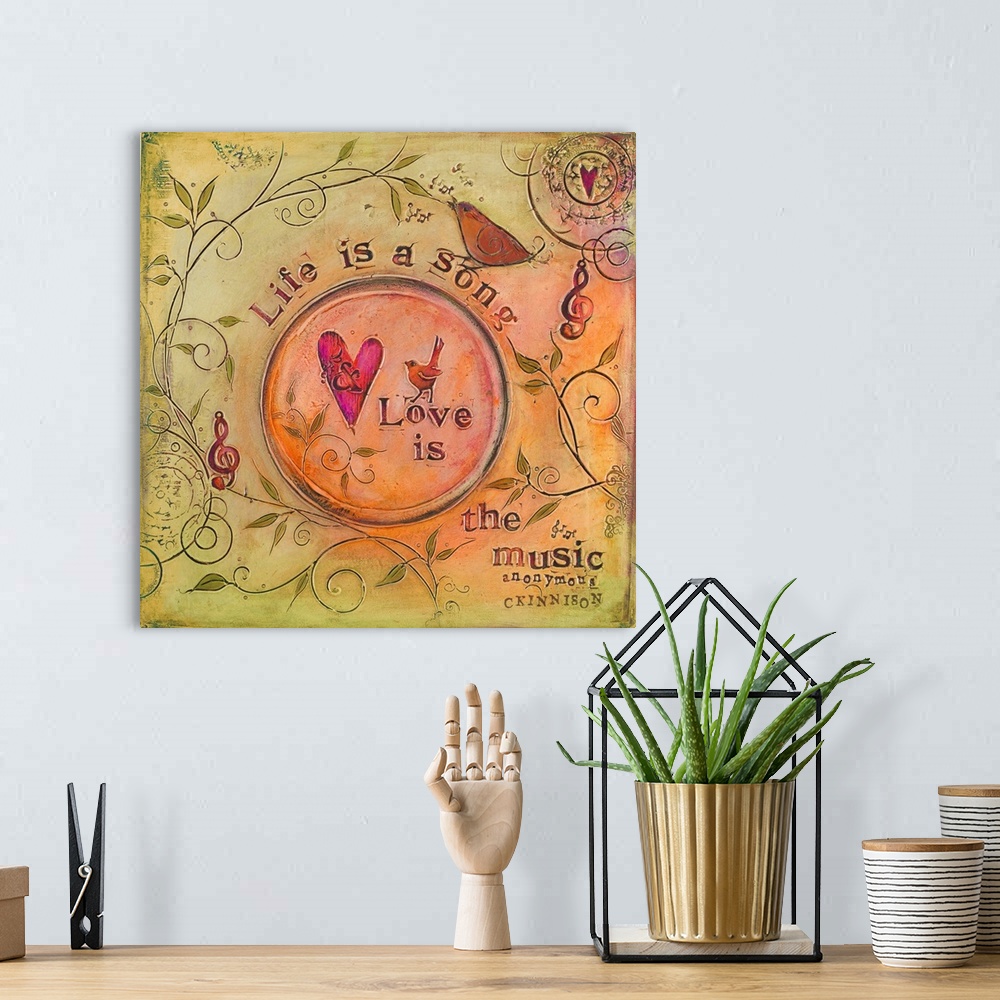 A bohemian room featuring Sentiment about love over a painting of birds and treble clefs.