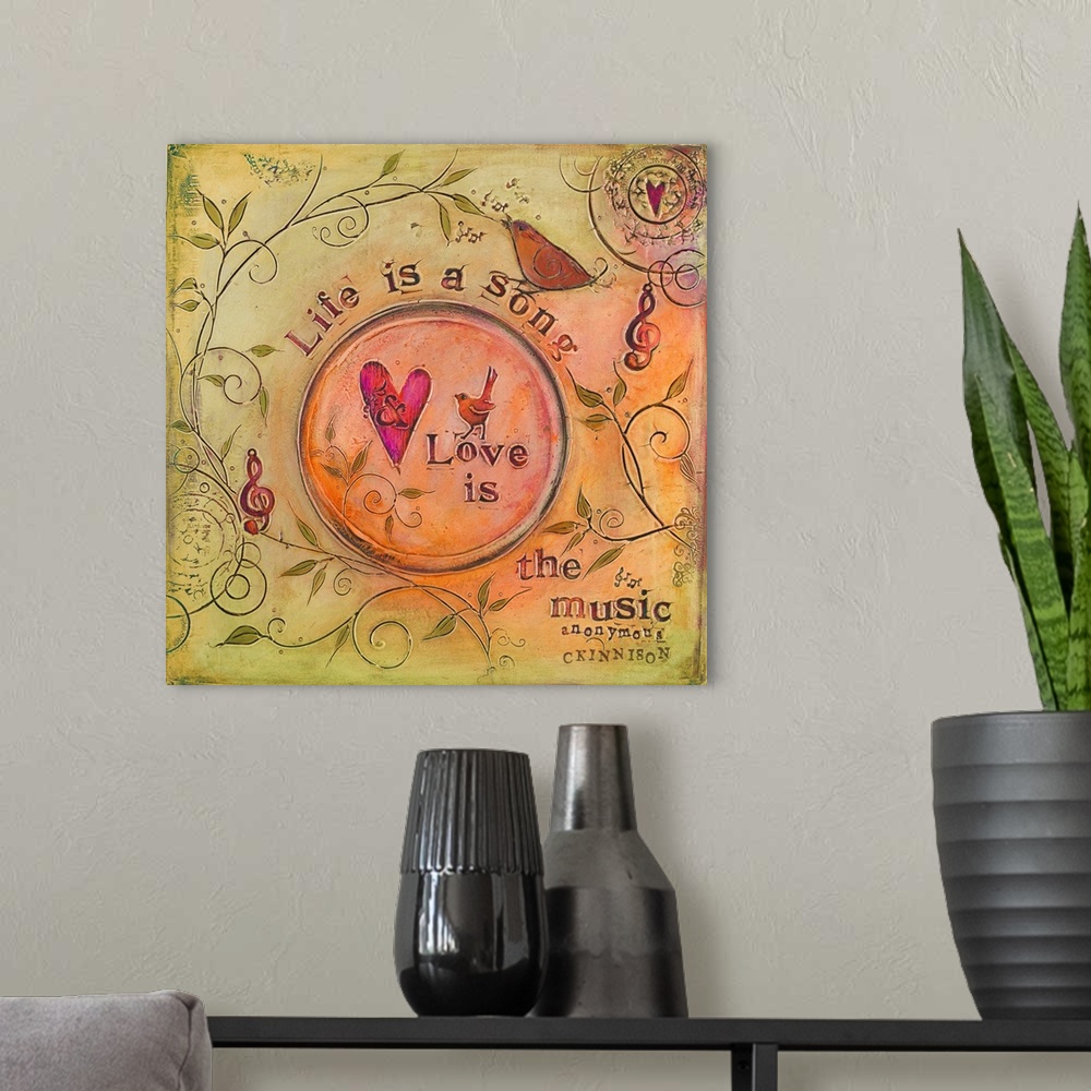 A modern room featuring Sentiment about love over a painting of birds and treble clefs.