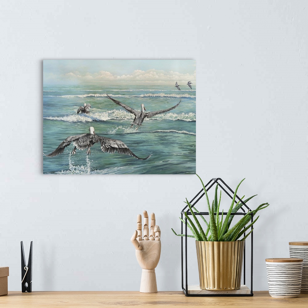 A bohemian room featuring Contemporary painting of a flock of pelicans flying across the water's surface.