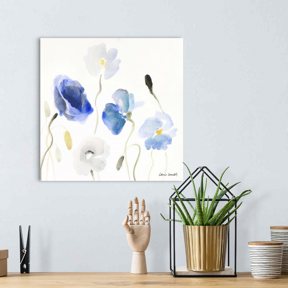 A bohemian room featuring A watercolor painting of blue poppy flowers.