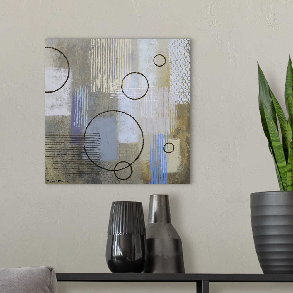 A modern room featuring Modern abstract artwork of a mix of rectangular patterns and circular shapes in mostly neutral to...
