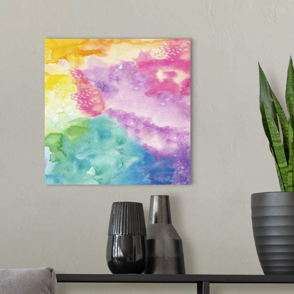 A modern room featuring Square abstract watercolor painting using all of the colors of the rainbow.