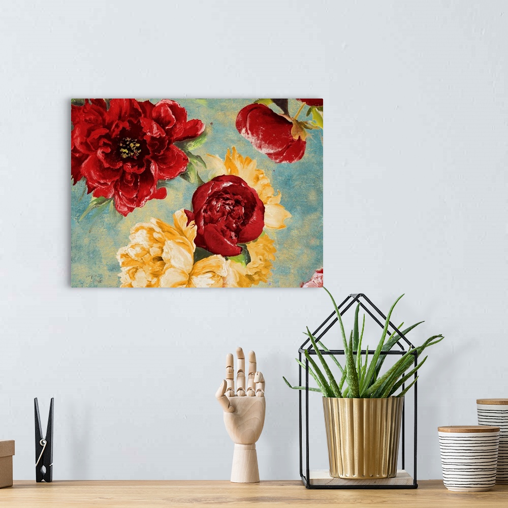 A bohemian room featuring Painting of a close-up of red and yellow flowers.
