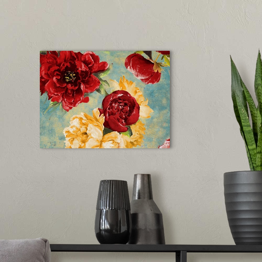 A modern room featuring Painting of a close-up of red and yellow flowers.