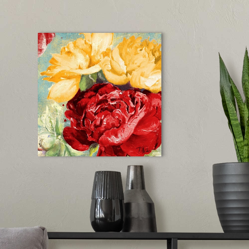 A modern room featuring Painting of a close-up of red and yellow flowers.