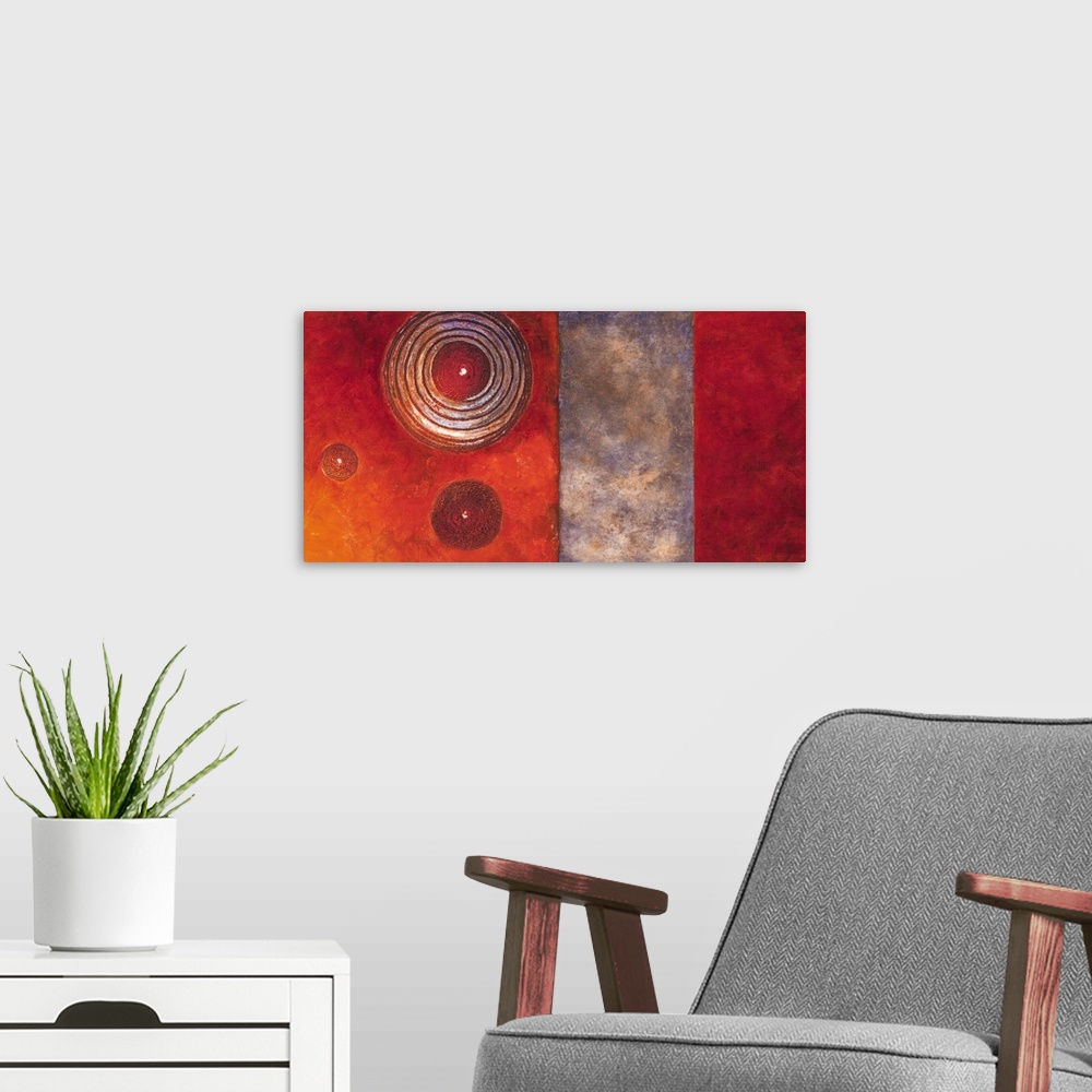 A modern room featuring Horizontal home art decor in warm tones featuring three circular designs over blocks of color.