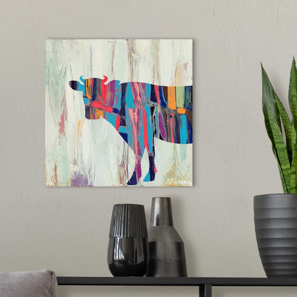 A modern room featuring Abstract painting of a cow silhouette with bright colors against a neutral background.