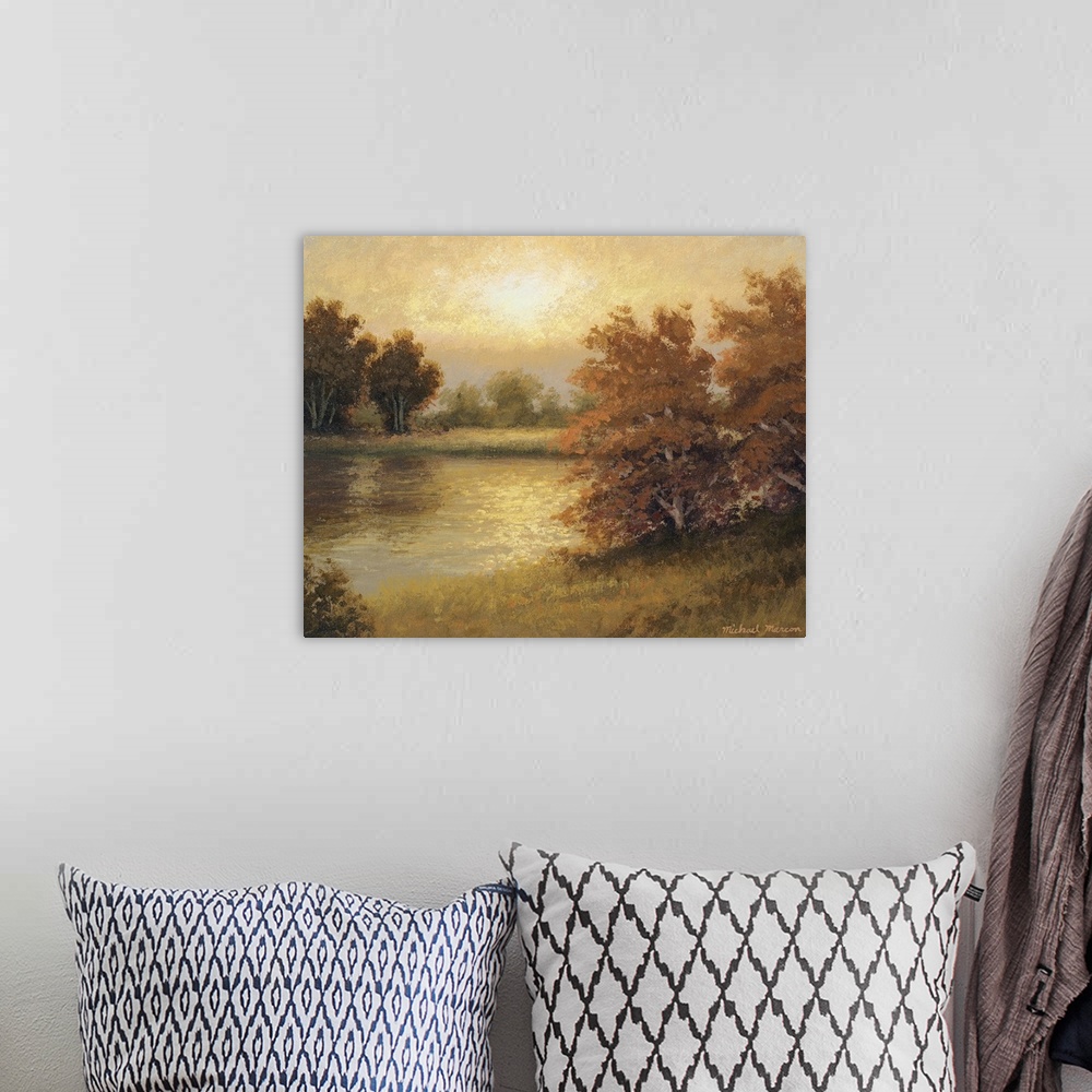 A bohemian room featuring Horizontal painting on big wall hanging of autumn colored trees surrounding a pond, the landscape...