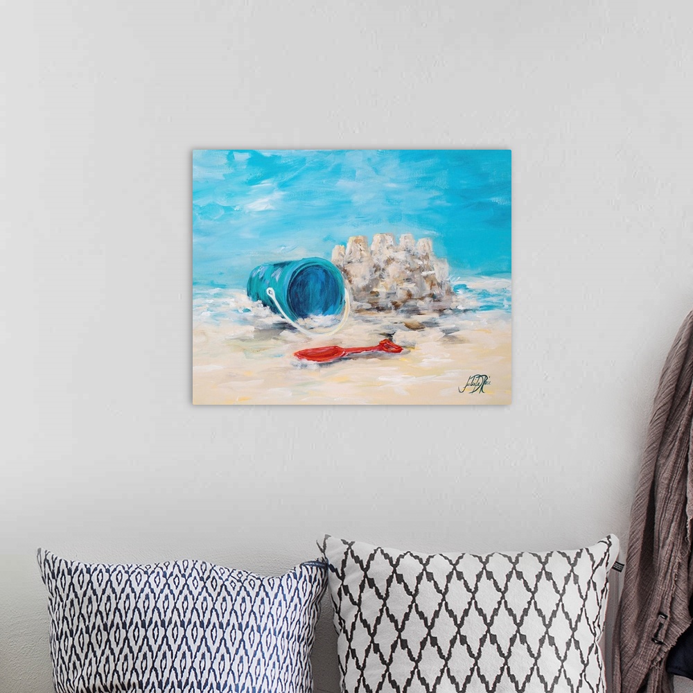 A bohemian room featuring Painting of a shovel and pail in the sand next to a small sandcastle.