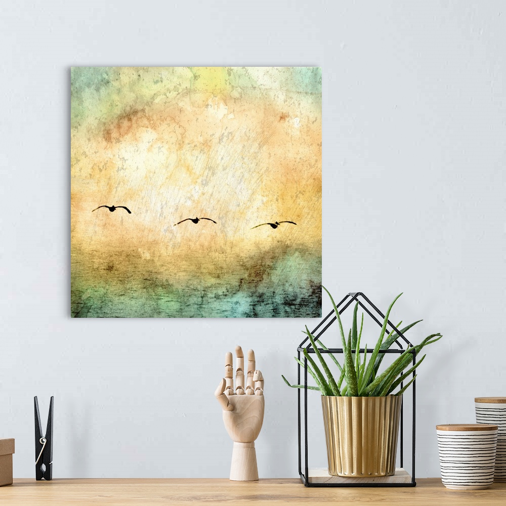 A bohemian room featuring Digital artwork of rainbow watercolor texture overlaid a photo of water with seagulls flying above.