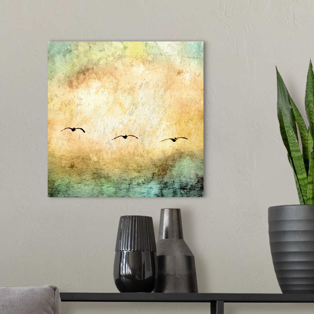 A modern room featuring Digital artwork of rainbow watercolor texture overlaid a photo of water with seagulls flying above.