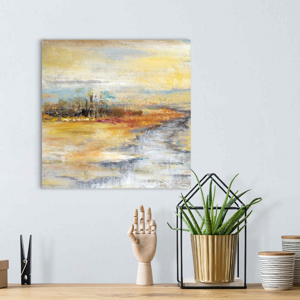 A bohemian room featuring Contemporary artwork of a river crossing through an orange landscape.