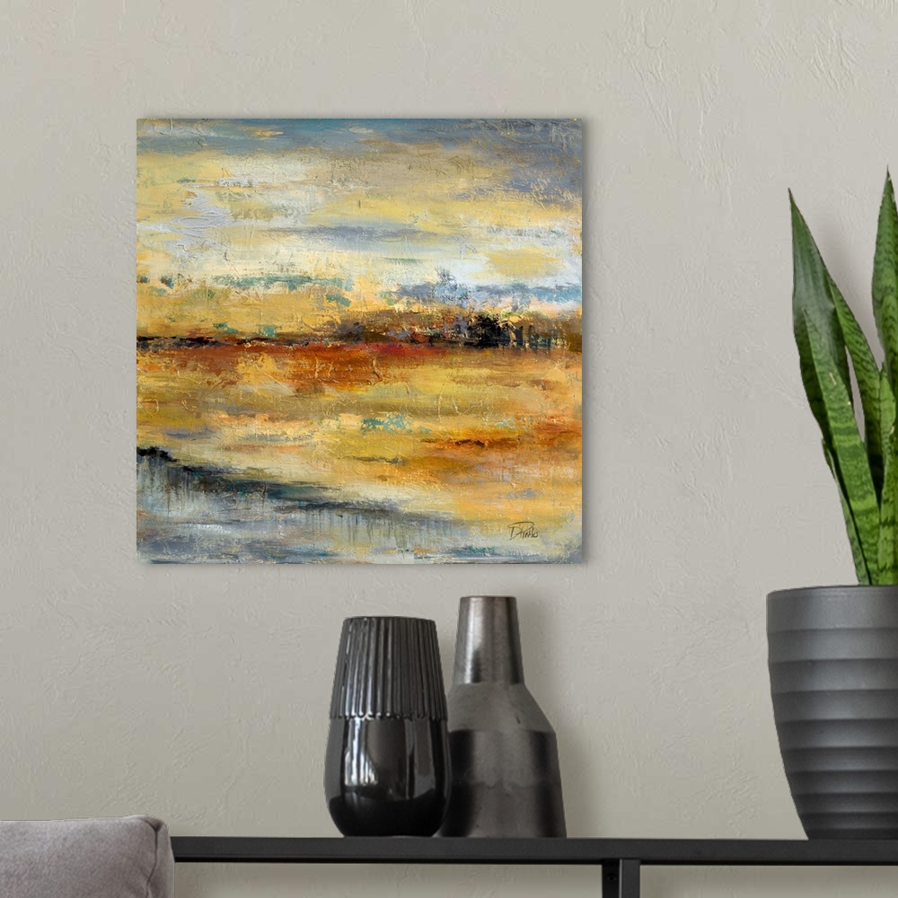 A modern room featuring Contemporary artwork of a river crossing through an orange landscape.
