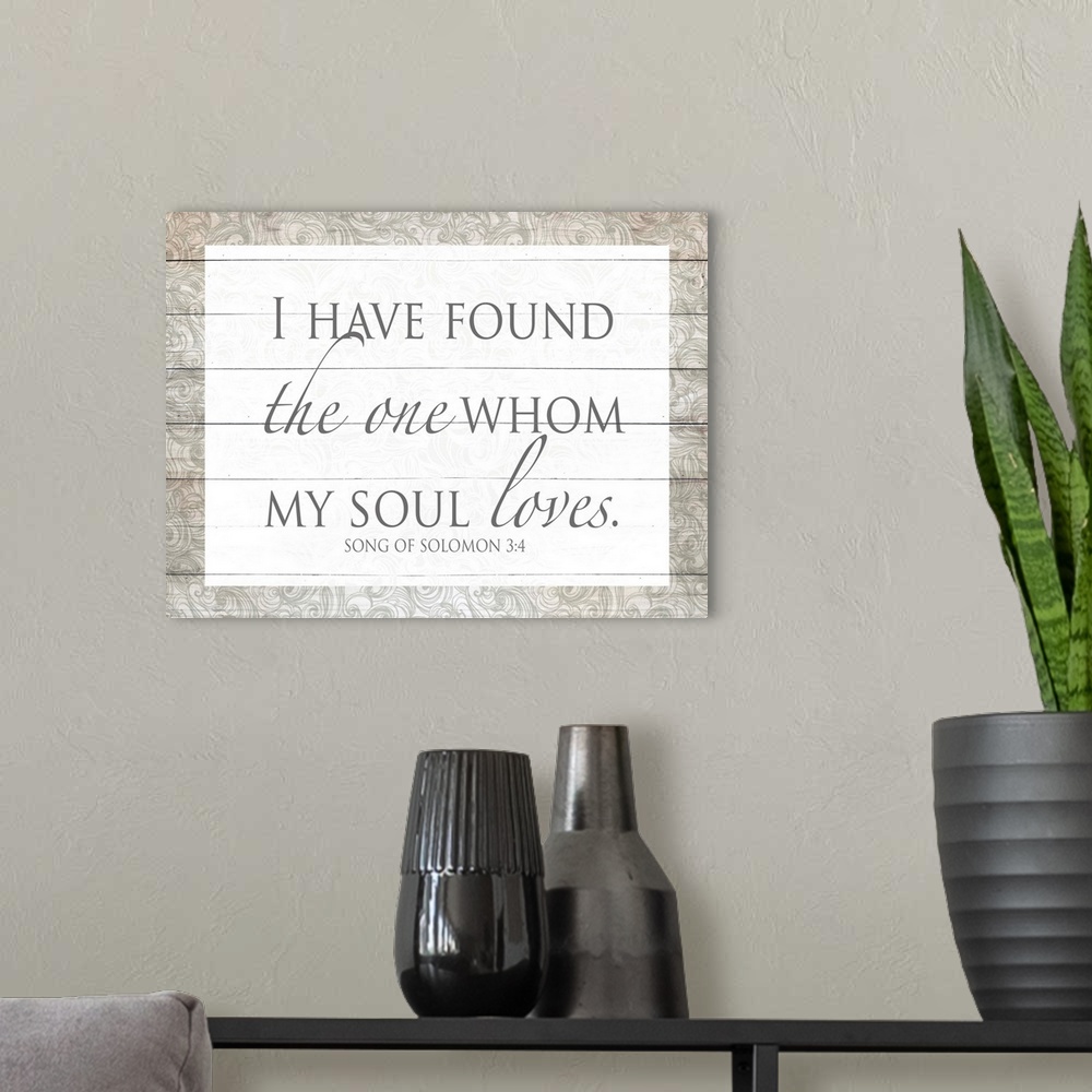 A modern room featuring "I Have Found the One Whom My Soul Loves." Song of Solomon 3:4 on a decorative wood paneled backg...