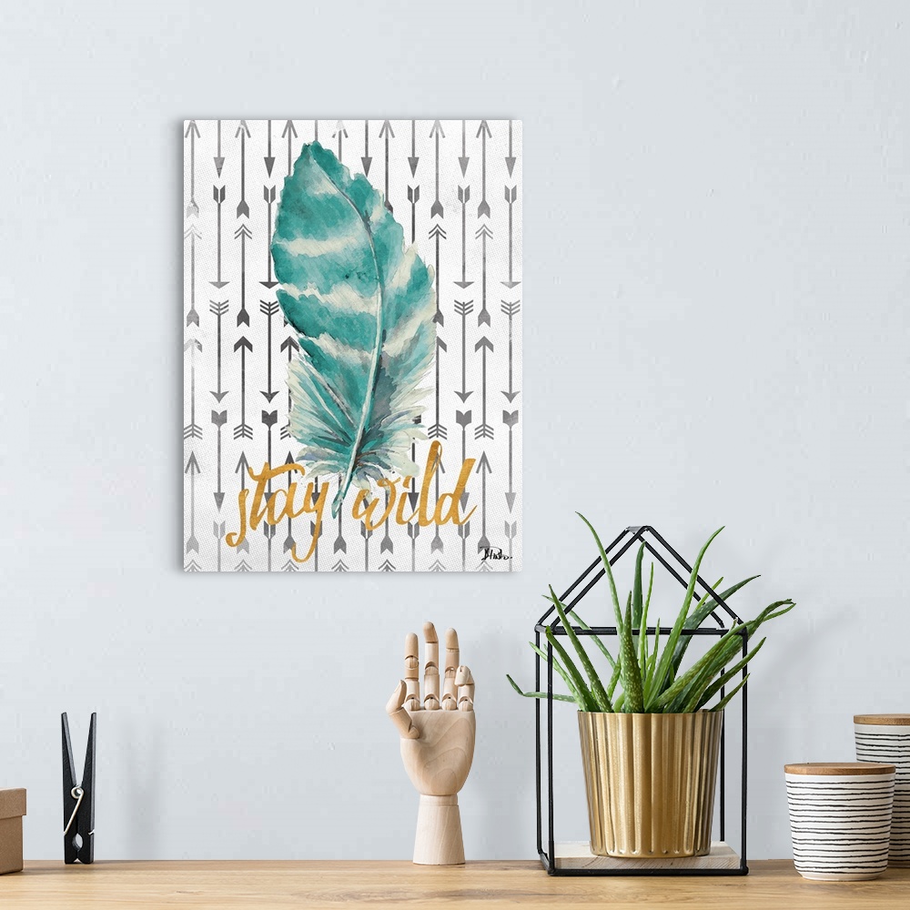 A bohemian room featuring A blue and white striped feather with arrows on the background and the phrase "stay wild" written...