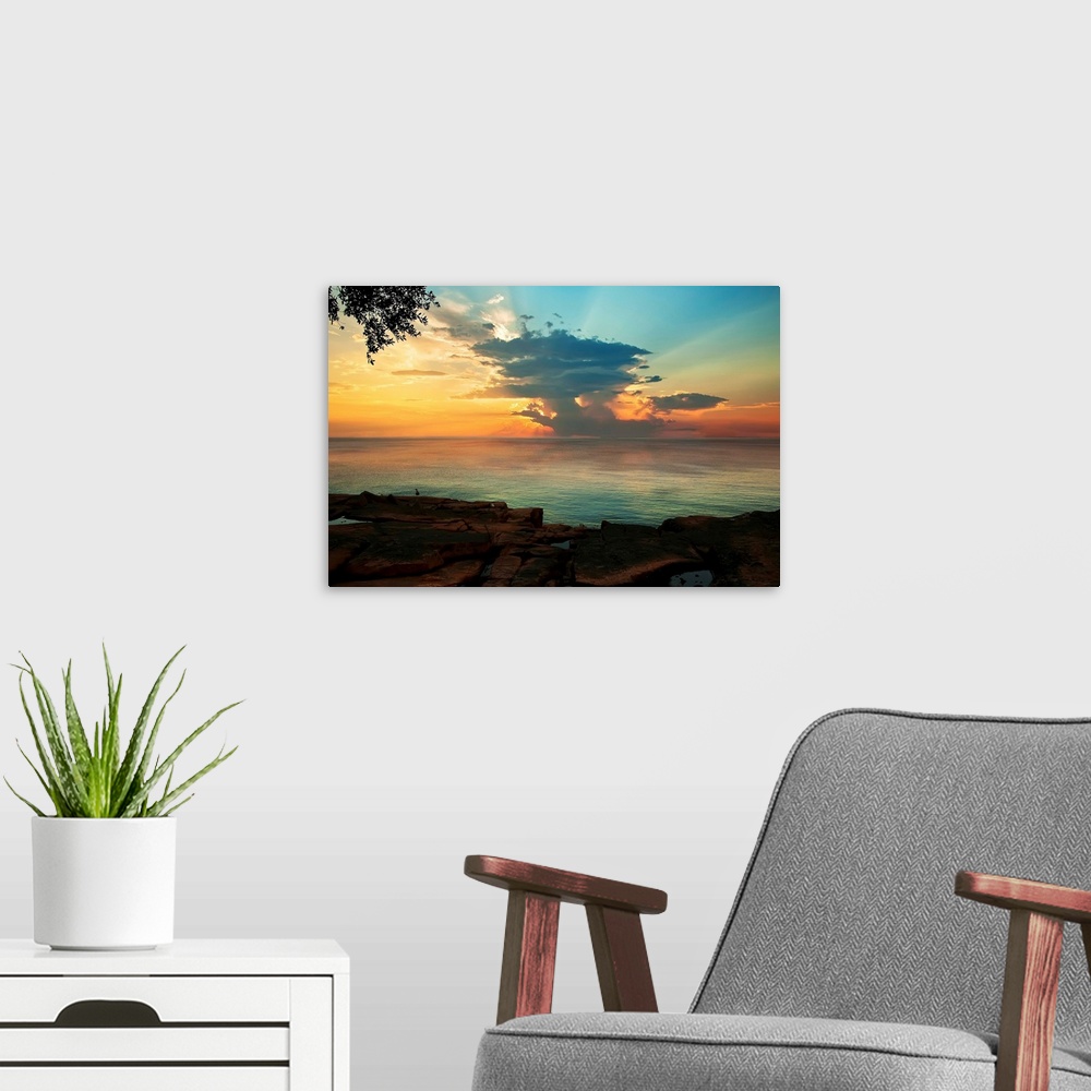A modern room featuring Contemporary painting of the sun on the horizon, seen from across the water.