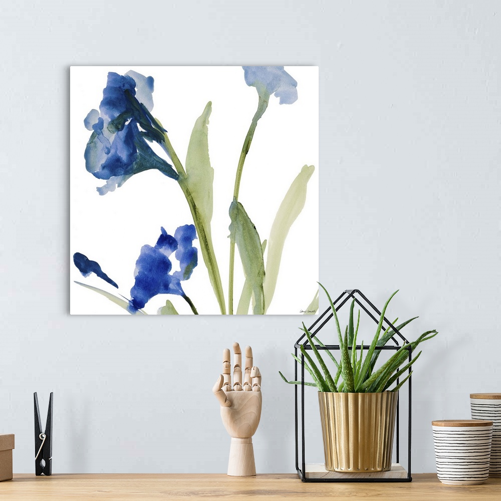 A bohemian room featuring Watercolor painting of blue flowers on green stems against a white background.