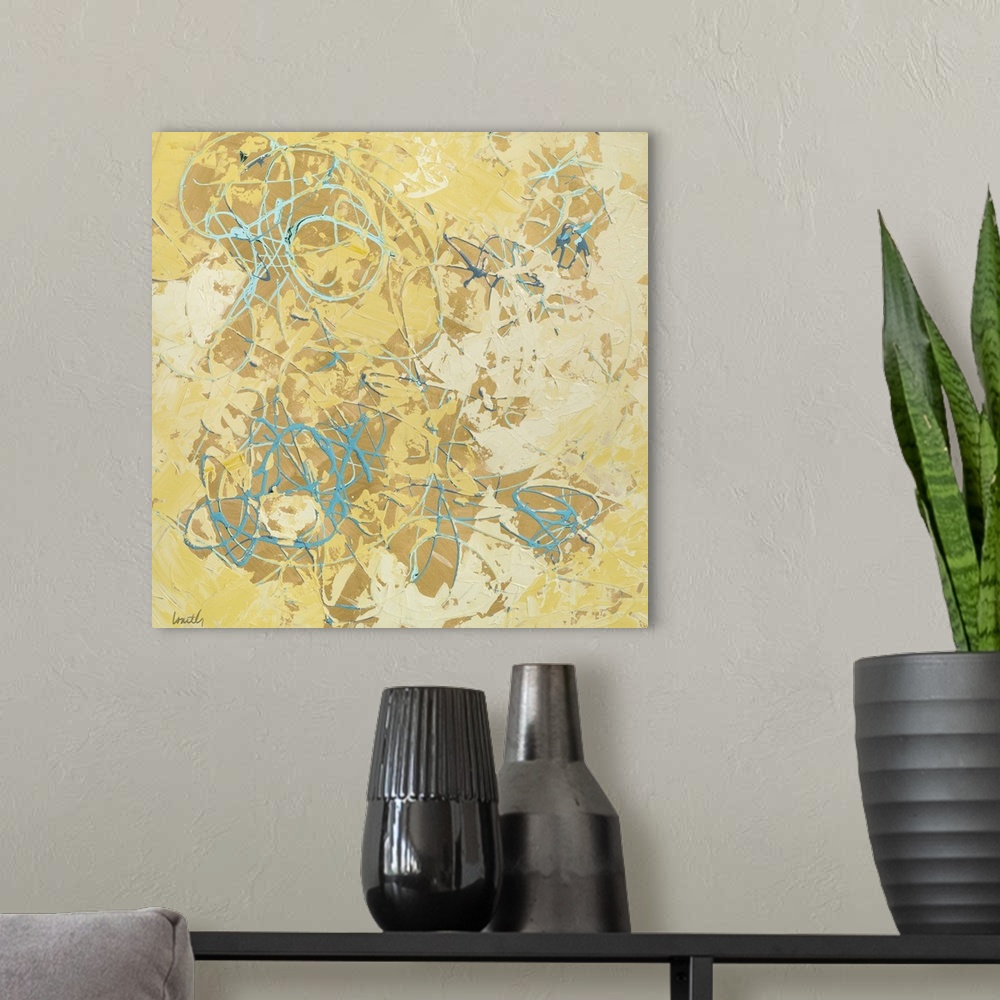 A modern room featuring Abstract contemporary painting in yellow shades with lots of texture.