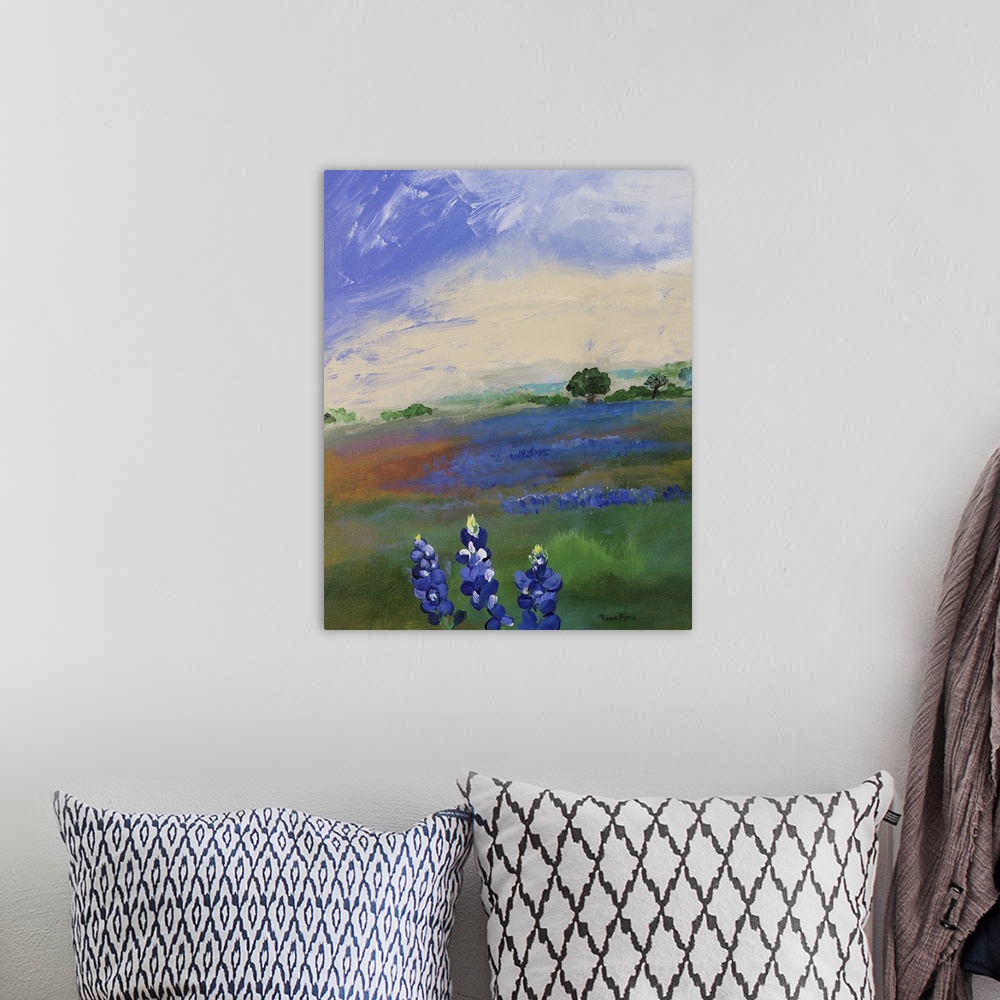 A bohemian room featuring An open field under a blue sky with bluebonnet flowers.