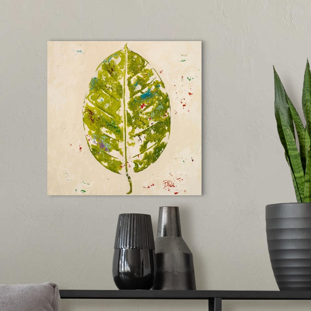 A modern room featuring Painting of a green tropical leaf against a beige background.