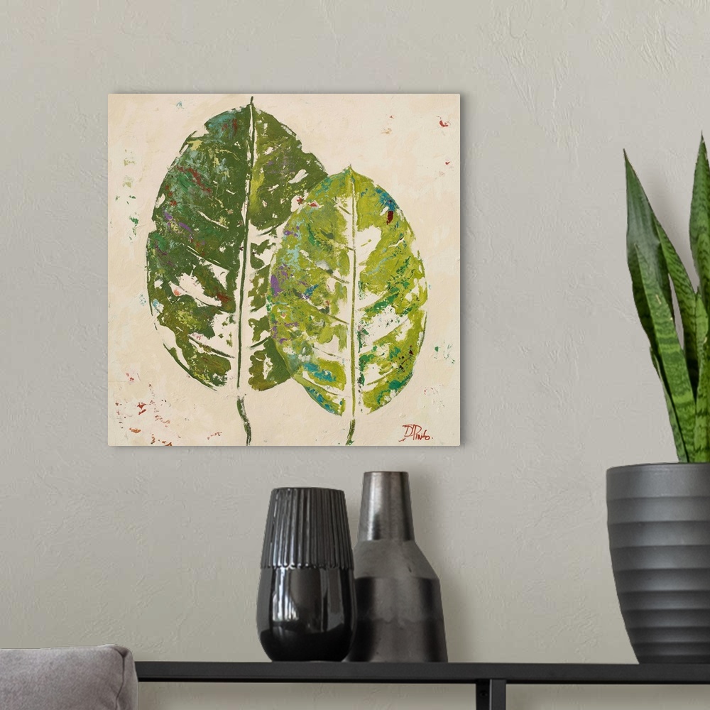 A modern room featuring Painting of green tropical leaves against a beige background.