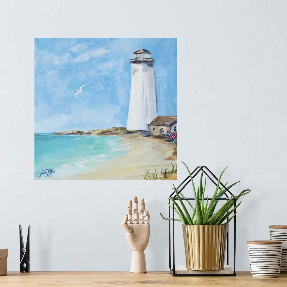 A bohemian room featuring Square painting of an all white lighthouse on the shore with a seabird flying above the ocean.