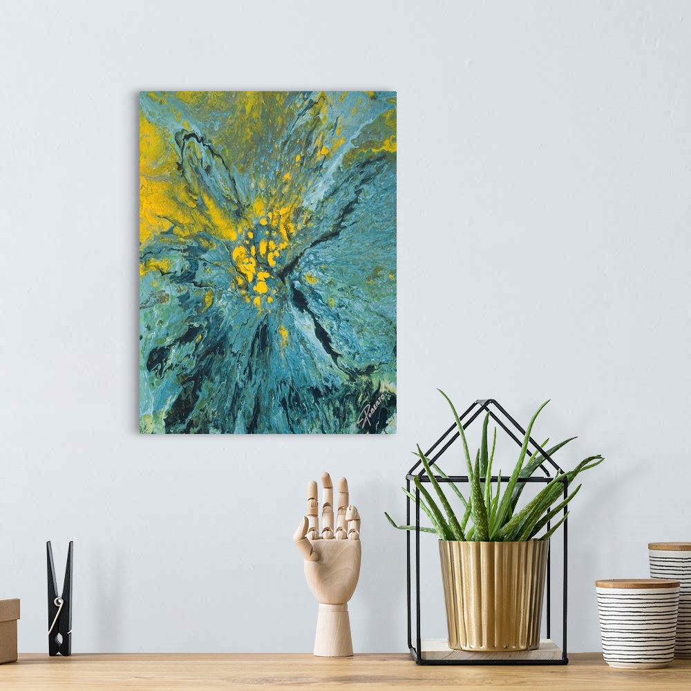 A bohemian room featuring Abstract painting that depicts a blue and yellow paint explosion on to canvas.