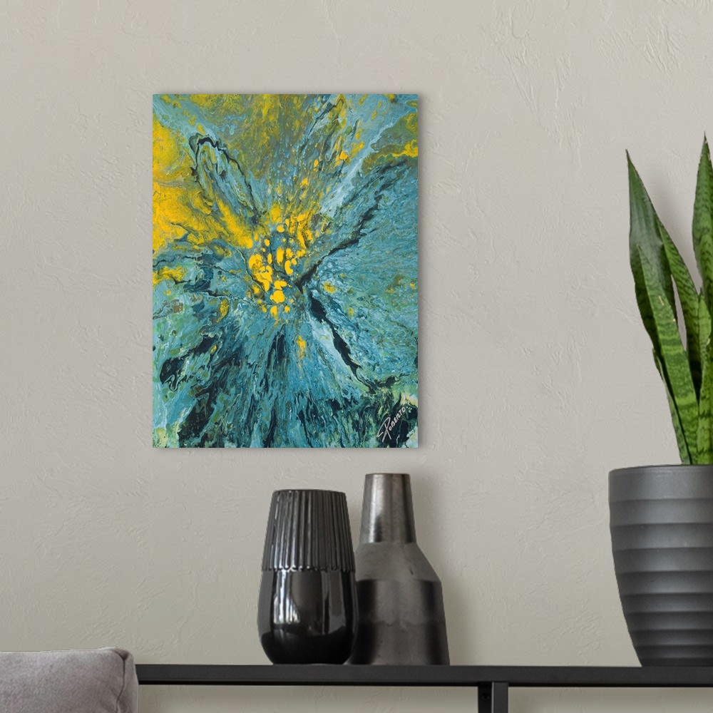A modern room featuring Abstract painting that depicts a blue and yellow paint explosion on to canvas.