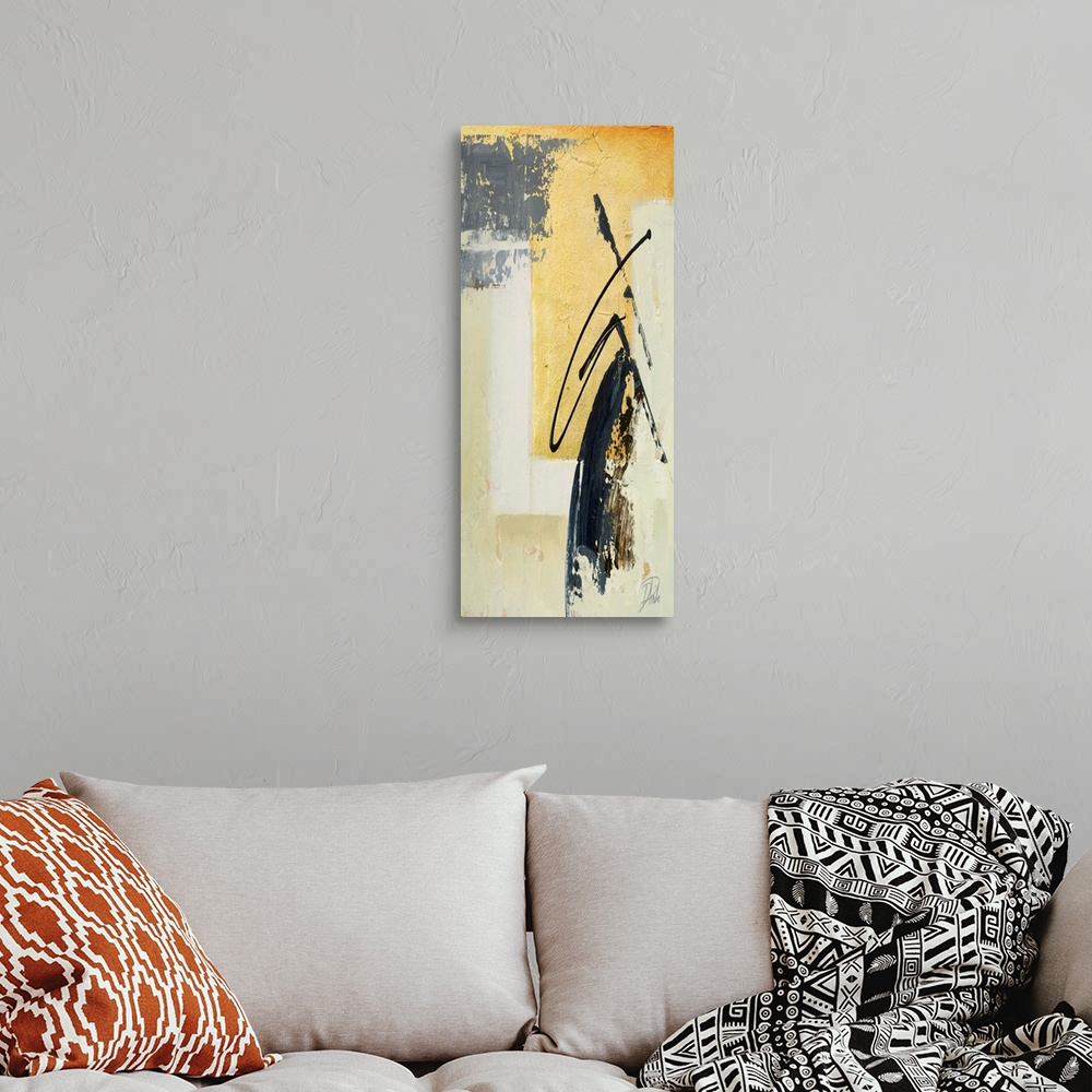 A bohemian room featuring A tall abstract painting with gold hues and a black design.