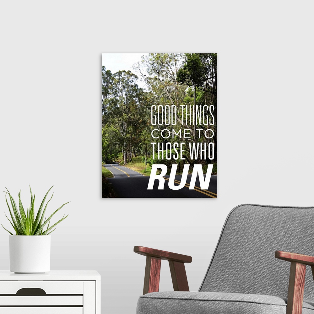 A modern room featuring Photo of a road through a forest with the phrase "Good things come to those who run."