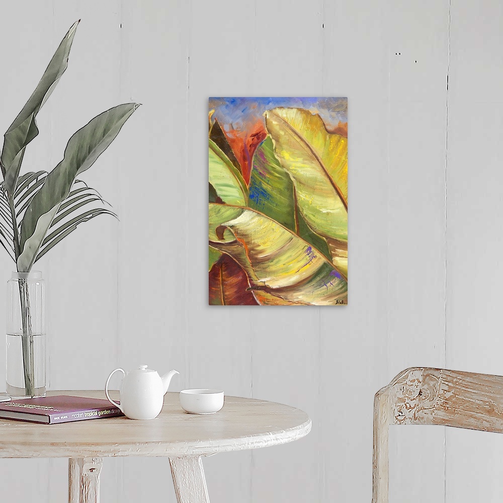 A farmhouse room featuring Contemporary painting of big lush tropical green leaves.