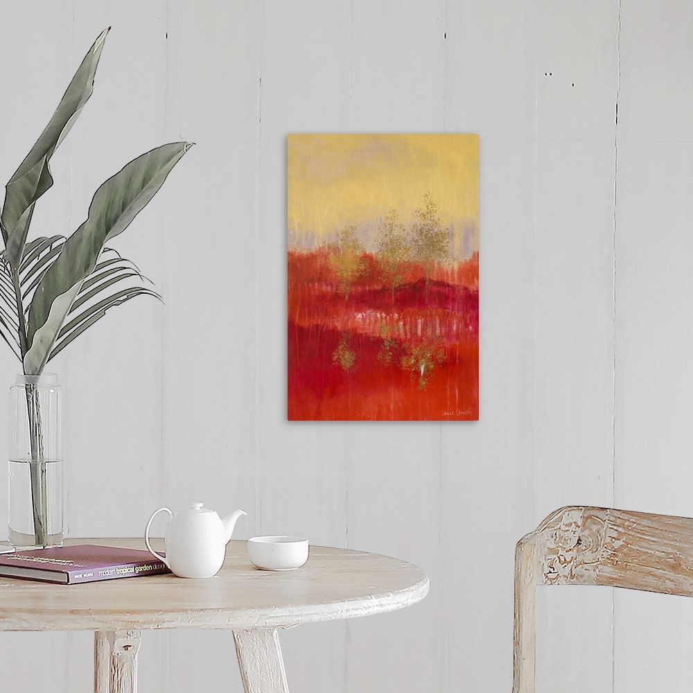 A farmhouse room featuring Abstract painting of a red and yellow landscape with golden trees.