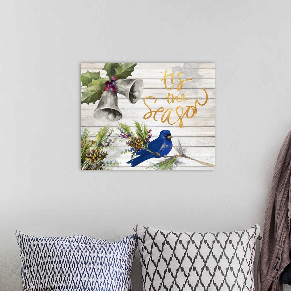 A bohemian room featuring "Tis the Season" with watercolor bells and a blue bird on a white wood panel background.