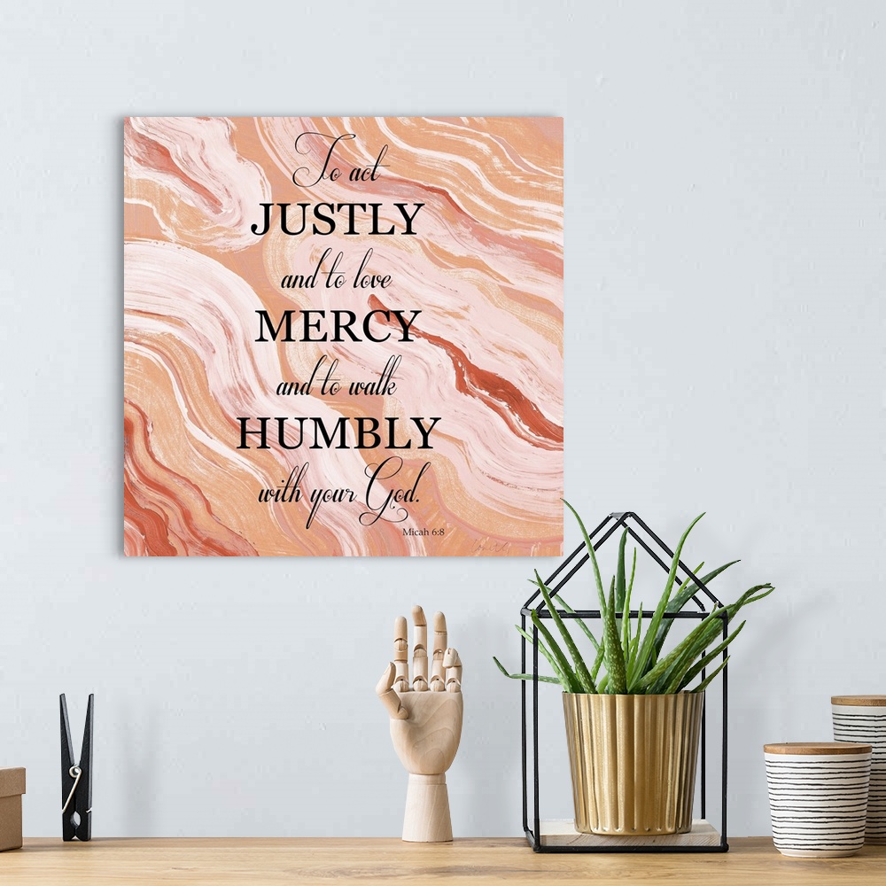 A bohemian room featuring Square abstract painting of agate in shades of orange and white with the bible verse "To act just...