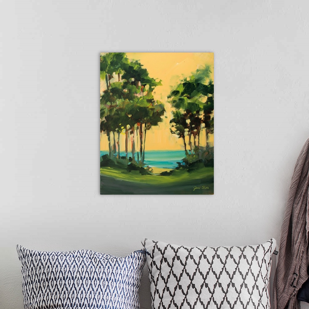 A bohemian room featuring Contemporary landscape painting with trees near the ocean.
