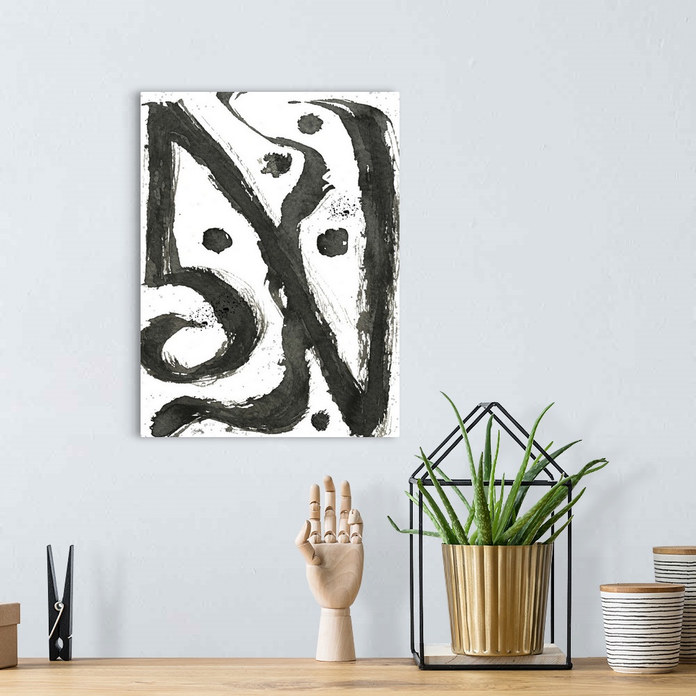 A bohemian room featuring Black and white abstract painting of tribal swirls.