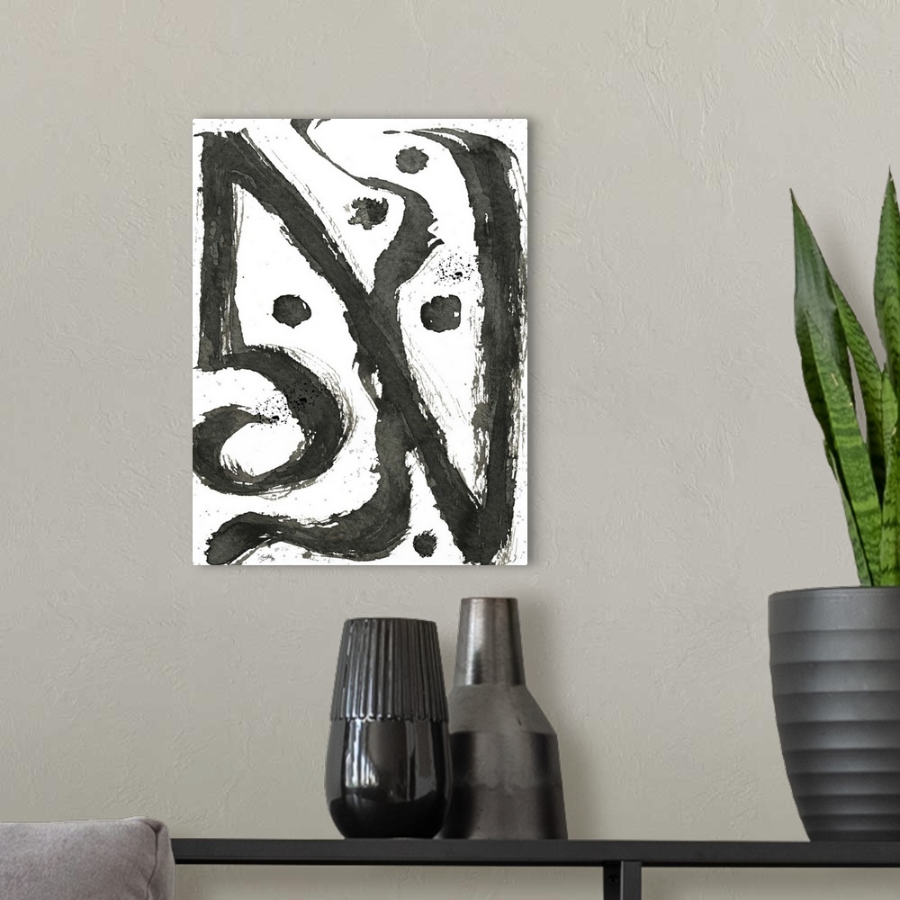 A modern room featuring Black and white abstract painting of tribal swirls.