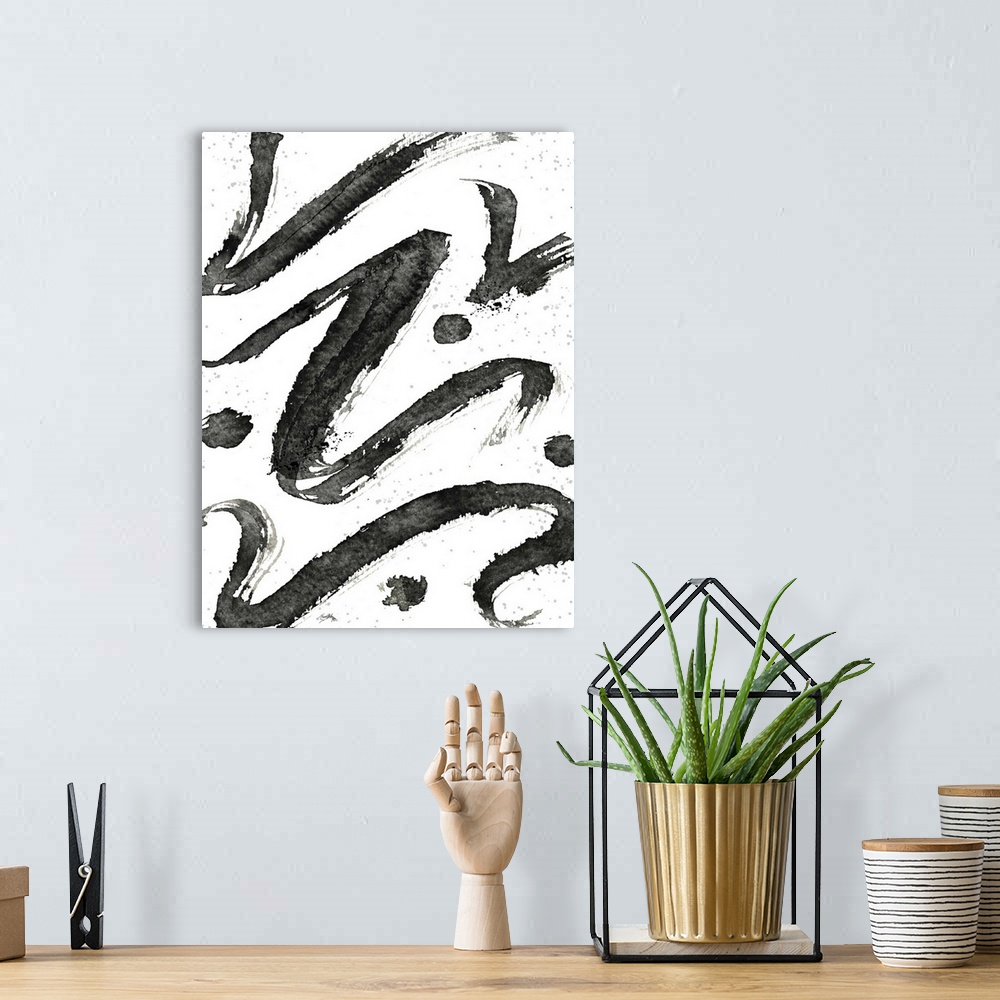 A bohemian room featuring Black and white abstract painting of tribal swirls with "z" shaped lines.